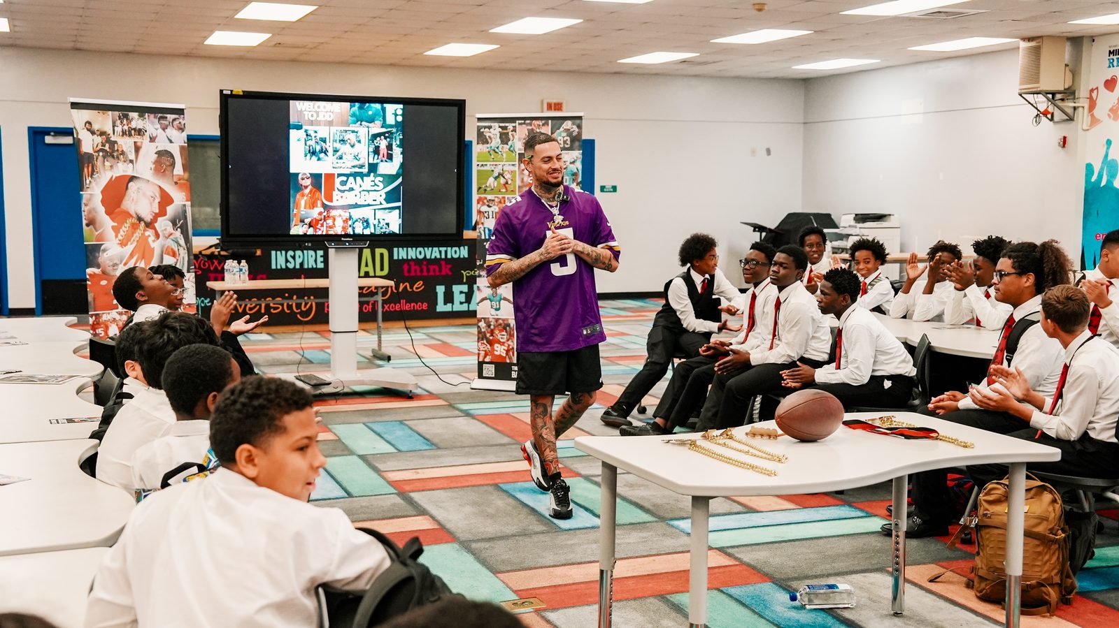 Steven speaking to a classroom of students